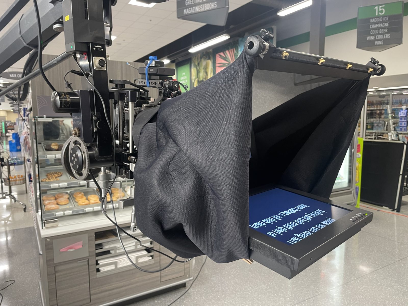 Jib-mounted camera with teleprompter on a store set