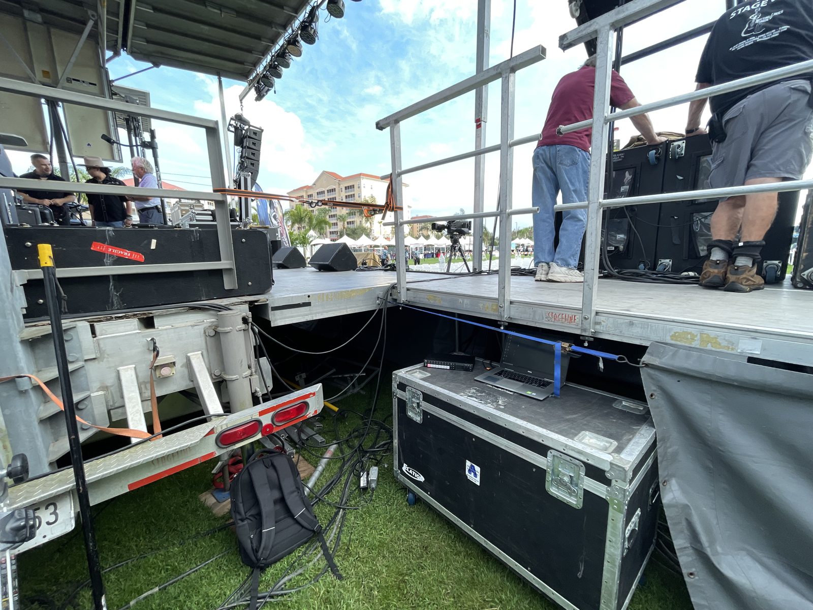 Outdoor rally stage with US flag backdrop and seating